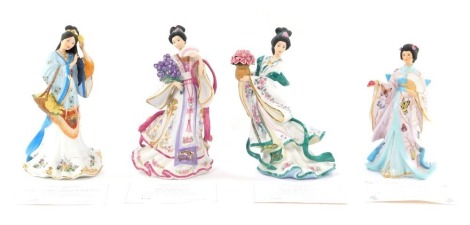 Four Danbury Mint collector's porcelain figures, comprising The Iris Princess, The Chrysanthemum Princess, the Rose Princess, and The Butterfly Princess, each with certificate of authenticity, boxed, 27cm high.