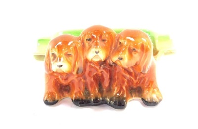 A Beswick pottery ashtray, modelled with three dogs, printed marks, 10cm wide.