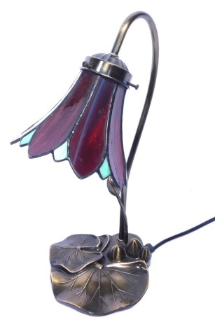 A Tiffany style table lamp, with red and blue flared floral shade, on an Art Nouveau style base, 38cm high.