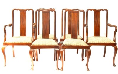 A set of six Edwardian dining chairs, each with pierced splat back, and drop-in floral seats, on cabriole legs.