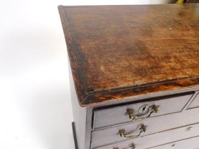 A 19thC oak chest, of three short and four long drawers, with brass handles and escutcheon, on bracket feet, 108cm high, 95cm wide, 49cm deep. (AF) - 4