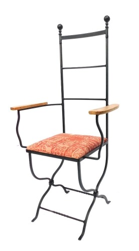 A wrought iron hall chair, with shaped and moulded bulbous tops, with pine lined arms, and a drop in upholstered seat, 122cm high, 62cm wide, 40cm deep. The upholstery in this lot does not comply with the 1988 (Fire & Fire Furnishing) Regulations, unless