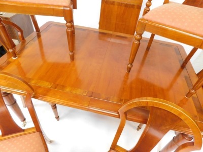 A walnut dining suite, comprising inlaid extending dining table and six matching chairs, including two carvers, the table 75cm high, 166cm wide, additional 51cm leaf, 111cm deep. (7) - 2