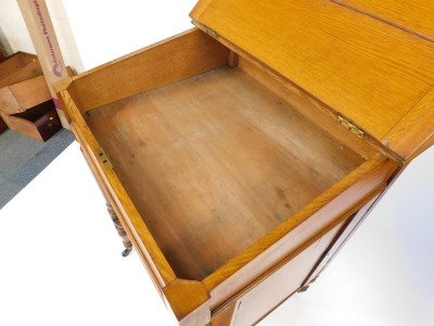 A Victorian oak clerk's desk, with galleried top with slope revealing desk top with the retailer's label for George Spademan, Cabinet Maker and Upholsterer, Stamford., over four fall flap drawer fronts, with Wellington locking action, opening to reveal pi - 3