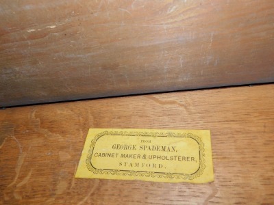 A Victorian oak clerk's desk, with galleried top with slope revealing desk top with the retailer's label for George Spademan, Cabinet Maker and Upholsterer, Stamford., over four fall flap drawer fronts, with Wellington locking action, opening to reveal pi - 4