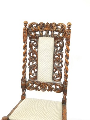 A 19thC oak hall chair, with heavily carved relief back, with two figures and crown, with drop-in seat and cushion. - 2