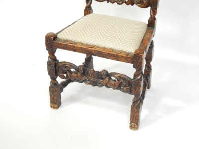 A 19thC oak hall chair, with heavily carved relief back, with two figures and crown, with drop-in seat and cushion. - 3