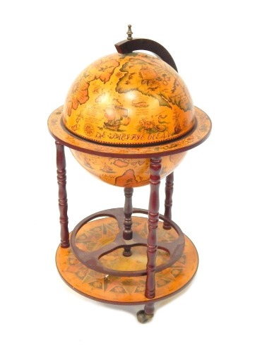 A late 20thC drinks globe trolley, on shaped mahogany base, with spin section, 93cm high.