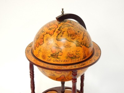 A late 20thC drinks globe trolley, on shaped mahogany base, with spin section, 93cm high. - 2