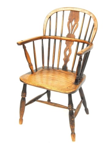 An early 19thC ash and elm Windsor chair, with pierced vase splat back, on tapered legs and H frame stretcher, 86cm high, 46cm wide.