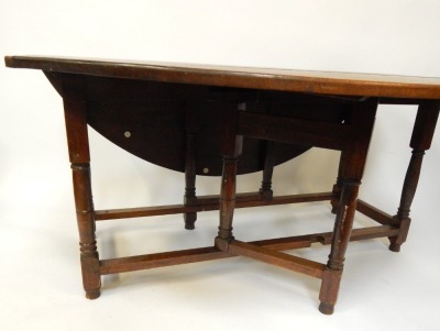 An 18thC style mahogany gate leg dining table, with three plank top on a turned base, 73cm high, 180cm wide, 150cm deep. - 3