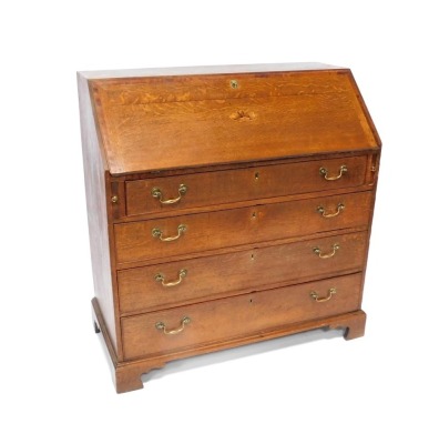 A Georgian oak bureau, with fall flap revealing a fitted interior, above an arrangement of two short and three long drawers, on bracket feet, 113cm high, 106cm wide, 53cm deep.