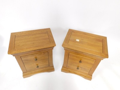 A pair of oak bedside cabinets, each with two drawers, 63cm high, 52cm wide, 38cm deep. - 2