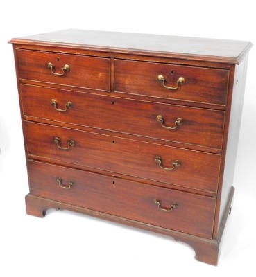 A George III mahogany chest, of two short and three long drawers, brass swan neck handles, terminating in bracket feet, 98cm high, 109cm wide, 54cm deep.