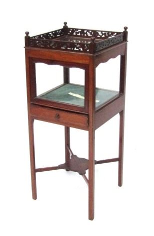 A Georgian mahogany night table converted to a bijouterie cabinet, the square set top with glass sides, with a fret gallery, parquetry inlaid under tier, on taper legs, 80cm high, the top 33cm square.