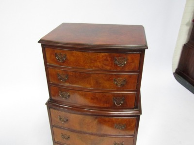 A reproduction burr walnut bow front chest on chest, each with three drawers with brass pierced back plate handles, on bracket feet, 114cm high, 51cm wide, 38cm deep. - 2