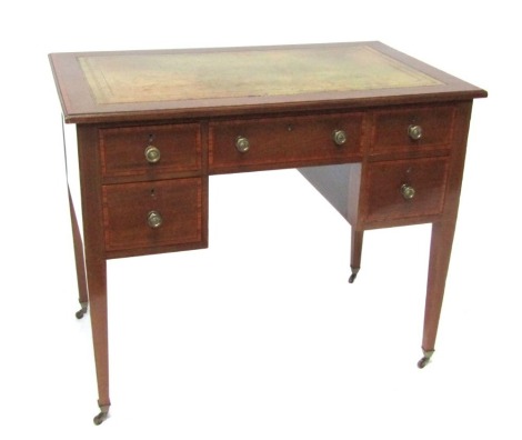 An Edwardian mahogany writing desk, with satinwood banded border, green leather inset top, above arrangement of one long drawer and two drawers to each side, on tapered legs, terminating in castors, 73cm high, 92cm wide, 55cm deep.