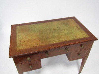 An Edwardian mahogany writing desk, with satinwood banded border, green leather inset top, above arrangement of one long drawer and two drawers to each side, on tapered legs, terminating in castors, 73cm high, 92cm wide, 55cm deep. - 3