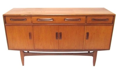 A teak mid century sideboard, with two short and one long drawer, above four cupboard doors on shaped supports, 88cm high, 150cm wide, 45cm deep.