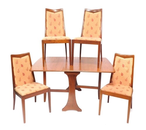 A G-Plan drop leaf table and four associated chairs, the drop leaf table with trestle base, 71cm high, 135cm wide when fully extended, 90cm deep, together with a set of four chairs. The upholstery in this lot does not comply with the 1988 (Fire & Fire Fur