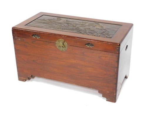 A mid 20thC camphorwood blanket chest, the rectangular panel with a depiction of warriors in boats, with vines and shell inlaid handles, 51cm high, 90cm wide, 46cm deep.