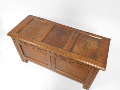 A 17thC carved oak coffer, with two panels top and front, Arabesque frieze, on stiles, 56cm high, 115cm wide, 46cm deep. - 2