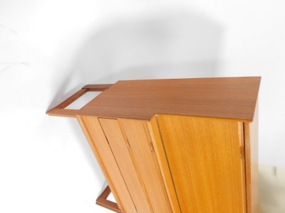 A teak mid century cocktail cabinet, the fall top above arrangement of three drawers, on shaped stiles, 114cm high, 91cm wide, 41cm deep. - 3