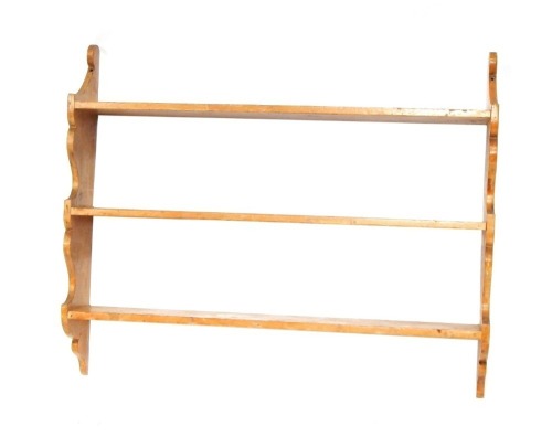 A pitch pine hanging wall shelf, three shelves on moulded supports, 75cm high, 92cm wide, 16cm deep.