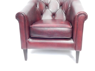 A maroon leather club chair, with button back on modern mahogany legs, 90cm high, 75cm wide. - 2