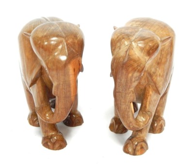 Two carved wooden elephant figures, each 38cm high.