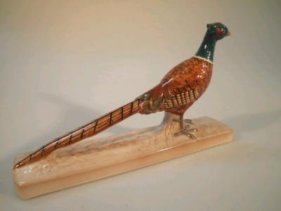 A Beswick pheasant on a rectangular base