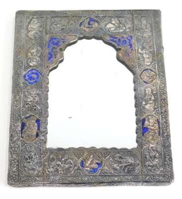 An Indian mirror, with shaped glass, profusely repousse decorated with panels and figures, inset with blue enamel, white metal, unmarked, 22cm x 17cm.