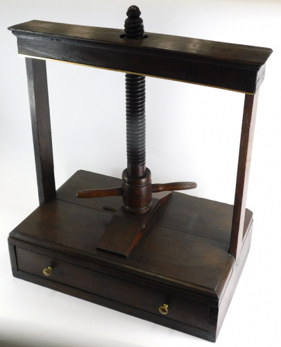 A 19thC oak book press, floor standing, with drawer to the front, 92cm high, 73cm wide, 45cm deep.