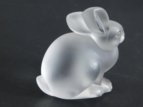 A 20thC Lalique clear and frosted glass figure of a rabbit, script mark, 7cm high.