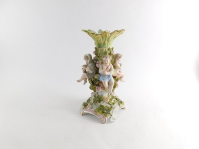 An early 20thC Sitzendorf porcelain centrepiece, formed with central bough surrounded by children, on a shaped base, raised with flowers with gilt highlights, double cross marks beneath, 30cm high. - 3