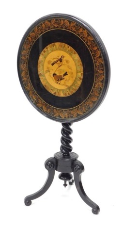 A Victorian Tunbridgeware table, the circular top inlaid with birds and leaves, within leaf mosaic border, on an ebonised ground, on spirally turned columns and a tripod base, 55cm wide.