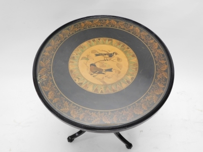 A Victorian Tunbridgeware table, the circular top inlaid with birds and leaves, within leaf mosaic border, on an ebonised ground, on spirally turned columns and a tripod base, 55cm wide. - 2