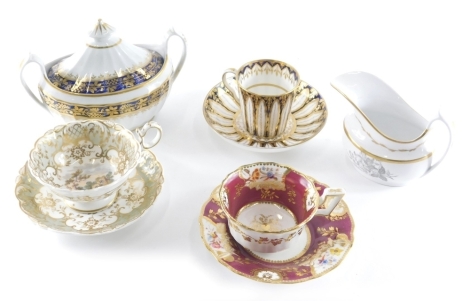 Various early 19thC porcelain, a Spode cabinet cup, 7cm high, and saucer decorated with acanthus leaves, on blue ground with gilt highlights, a 19thC Spode bat printed floral spray jug, two handled sucrier, and two further cabinet cups and saucers, to inc