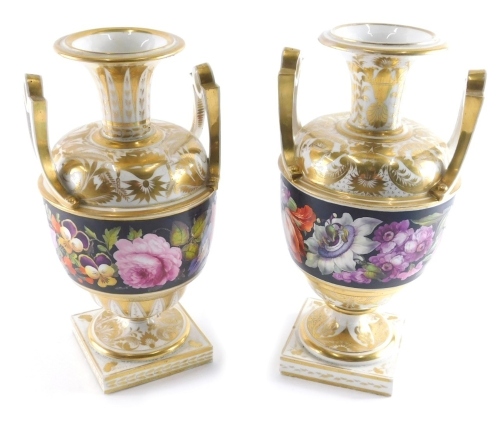 A pair of 19thC Derby porcelain vases, with raised handles, gilded floral stencilling, and bands of further flowers, on inverted stems and square feet, red crown marks beneath, 22cm high.