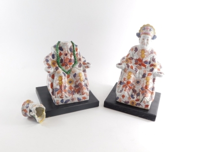 A pair of 20thC Chinese Imari Imperial style figures, in floral robes, predominantly in orange and blue, 29cm high. (2, AF) - 2