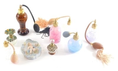 Various perfume atomizers, etc., one with floral top, 9cm high, various others, and a bisque porcelain cherub plaque. (a quantity)