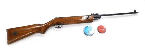 A Chinese .22 calibre air rifle, with two tins of pellets.