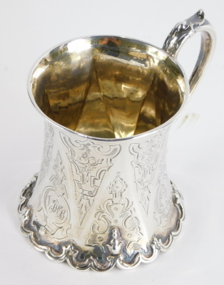 A Victorian silver christening mug, with scroll base and thumb mould handle, chased with scrolls and geometric pattern, London 1854, 11cm high, 4.3oz.