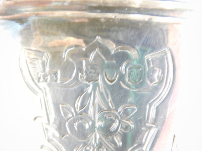 A Victorian silver christening mug, with scroll base and thumb mould handle, chased with scrolls and geometric pattern, London 1854, 11cm high, 4.3oz. - 3