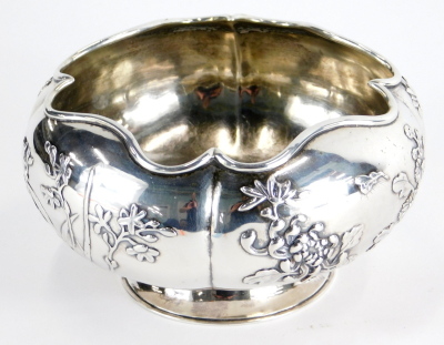 A 20thC Chinese silver bowl, by Zee Wo Shanghai, raised with flowers, on circular foot, impressed marks beneath, 14cm diameter, 7.9oz.