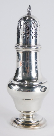 An Edward VII silver sugar sifter, by Asprey, with pierced domed lid, flame finial, bellied body and circular domed foot, engraved 1907, Chester 1905, 24cm high, 5oz. (weighted)