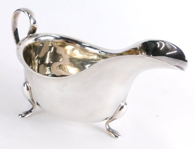 A George V silver sauce boat, with plain swan handle, triple hoof feet, Birmingham 1913, 10cm high, 6.8oz.