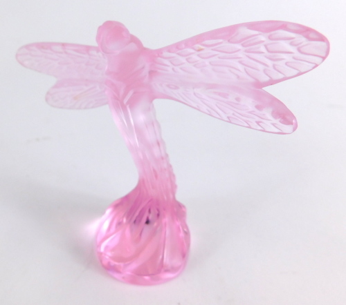 A 20thC Lalique pink glass dragonfly, marked beneath, 9cm high.