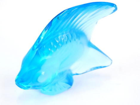 A 20thC Lalique blue glass figure of a fish, signed, 6cm high.