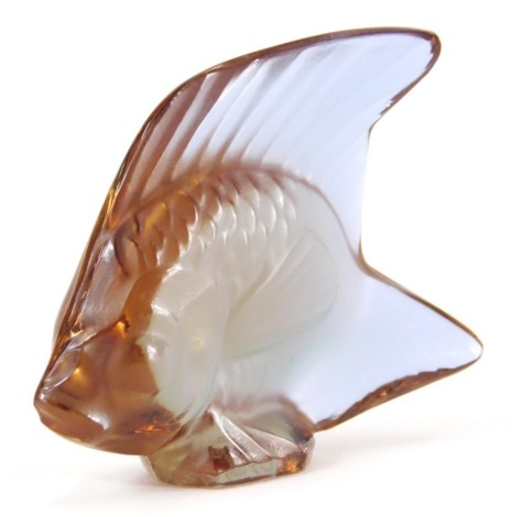 A 20thC Lalique purple glass figure of a fish, signed, 6cm high.